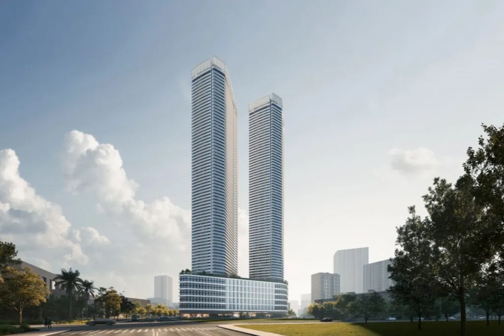 Exterior view of Shang Summit’s twin high-rise towers surrounded by landscaped city greenery