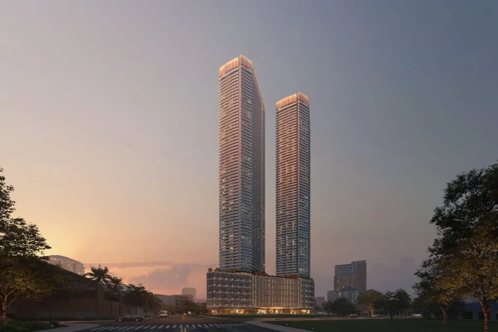 Shang Summit twin residential towers at sunset in a landscaped city setting