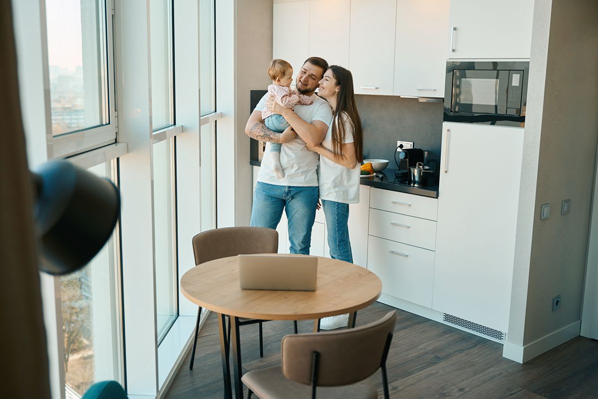 Family enjoying everyday life together inside a modern condominium residence