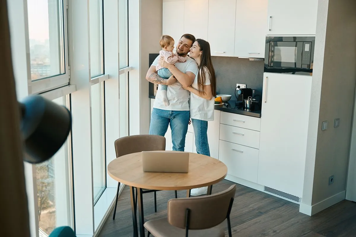 Family enjoying everyday life together inside a modern condominium residence