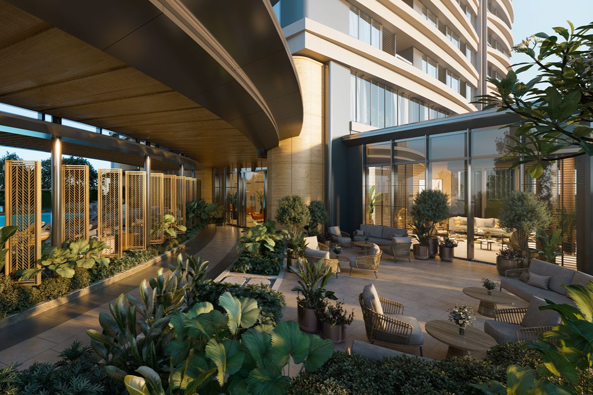 Bright condominium living space with floor-to-ceiling windows, natural light, greenery, and panoramic city views